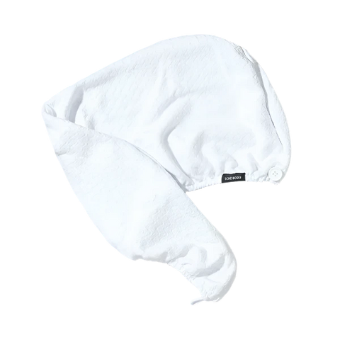 bondi boost white hair turban with small white button on the front to secure the turban with the loop on the back.