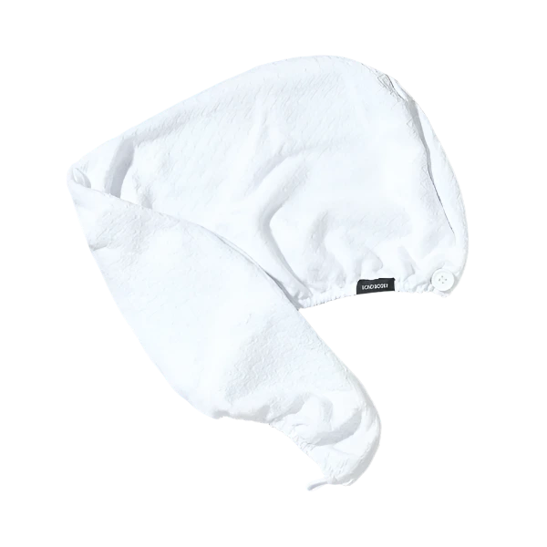 bondi boost white hair turban with small white button on the front to secure the turban with the loop on the back.