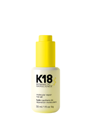 K18 repair hair oil bottle on a yellow background