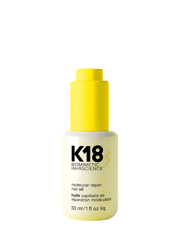 K18 repair hair oil bottle on a yellow background