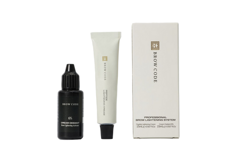 Brow Code skincare products including a bottle, tube, and box on a white background