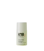 K18 leave in molecular repair hair mask bottle on a green background