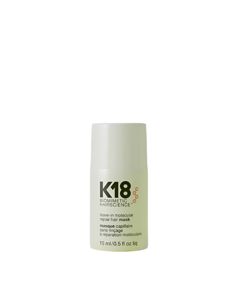 K18 leave in molecular repair hair mask bottle on a green background