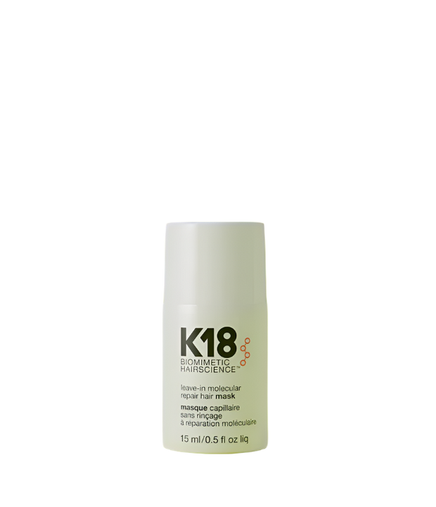 K18 leave in molecular repair hair mask bottle on a green background