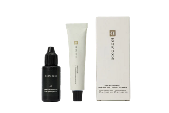 Brow Code eyebrow care products including a serum, cream, and box on a white background