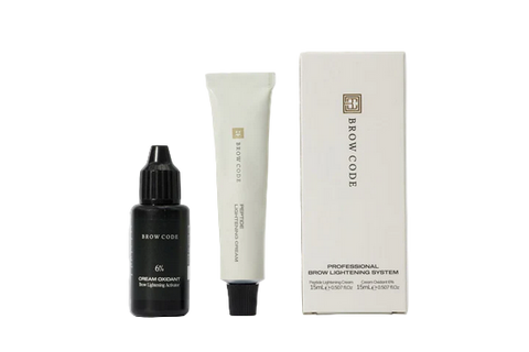 Brow Code eyebrow care products including a serum, cream, and box on a white background
