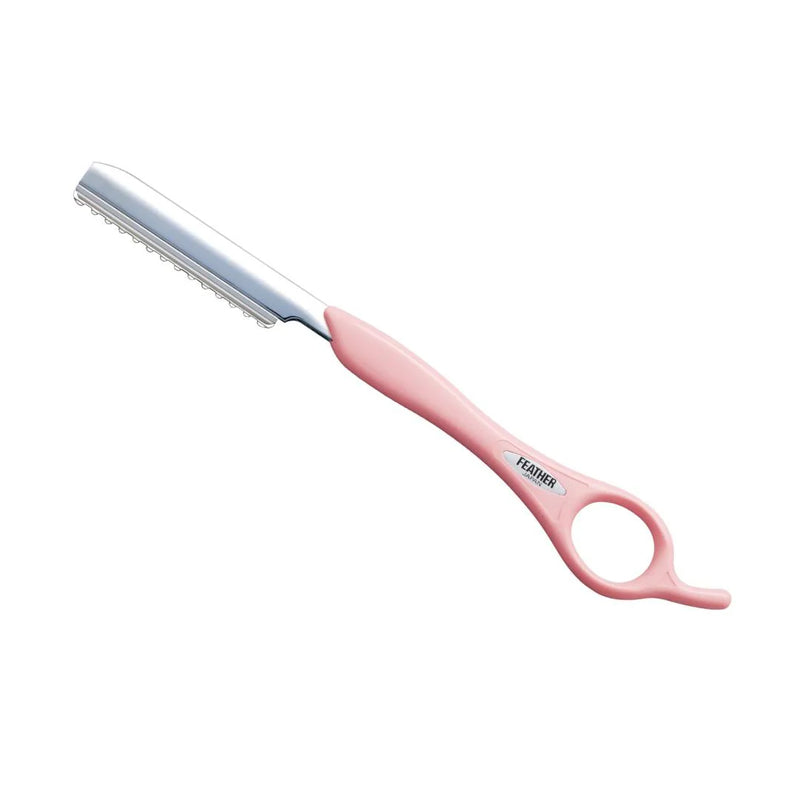 Pink feather razor comb with metal teeth on a white background