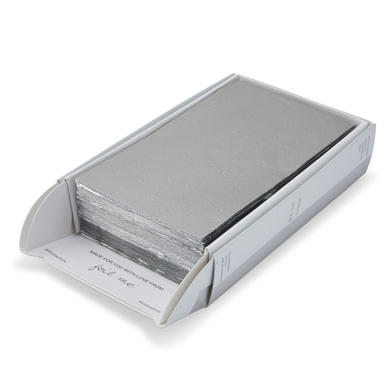 White box with foils inside the box with the brand name ' foil me ' ontop of a white background