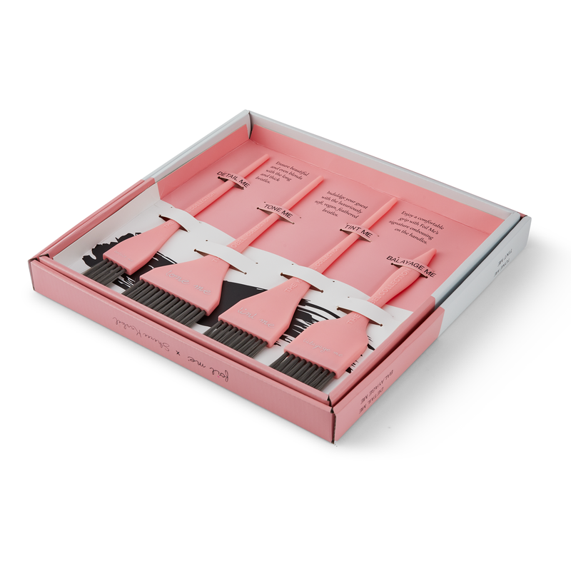 Set of pink tint brushes in a box on a white background