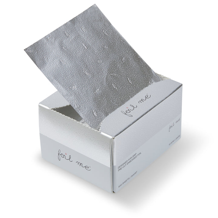 Silver foil sheet in an open box on a white background