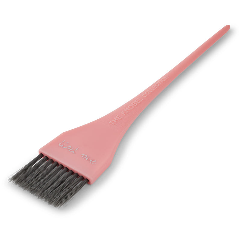Pink tint brush
 with black bristles on a white background